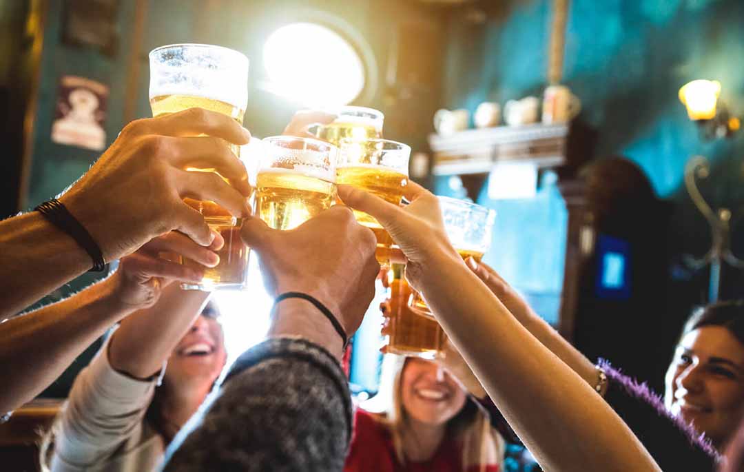 Group of people toasting beers