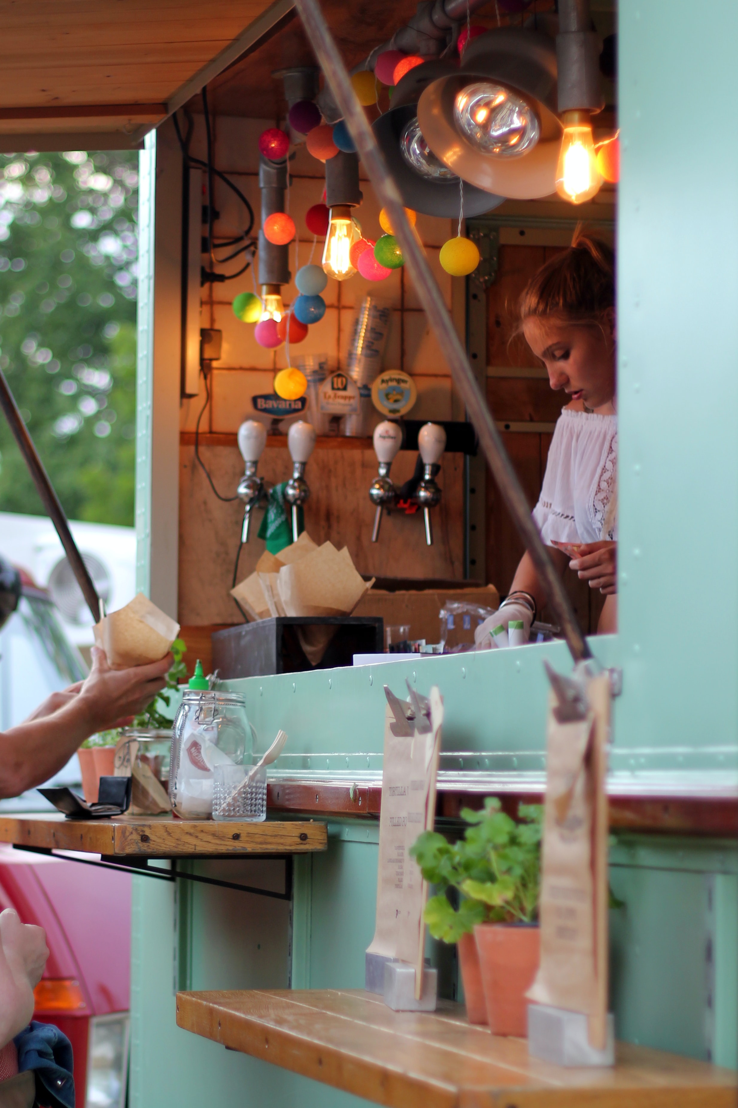 Person ordering at streetfood car